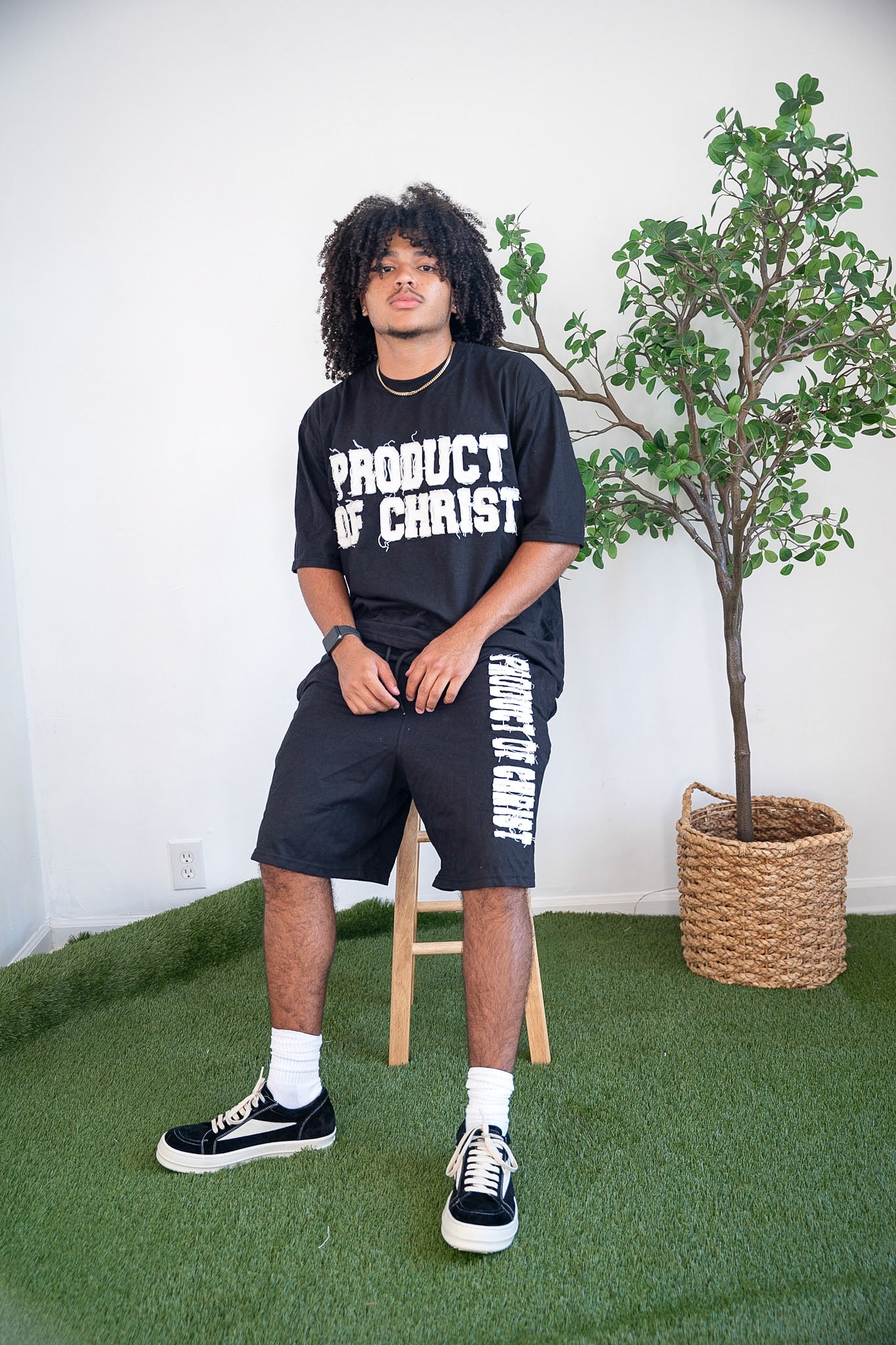 BLACK PRODUCT OF CHRIST SHORTS